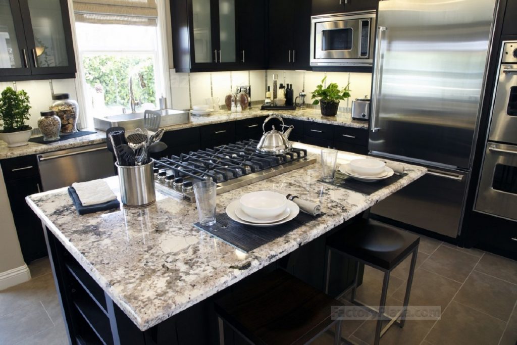 Black kitchen cabinets with Delicatus granite Countertops
